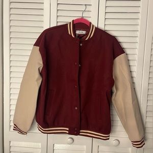 Varsity Jacket never worn in great condition slightly oversized